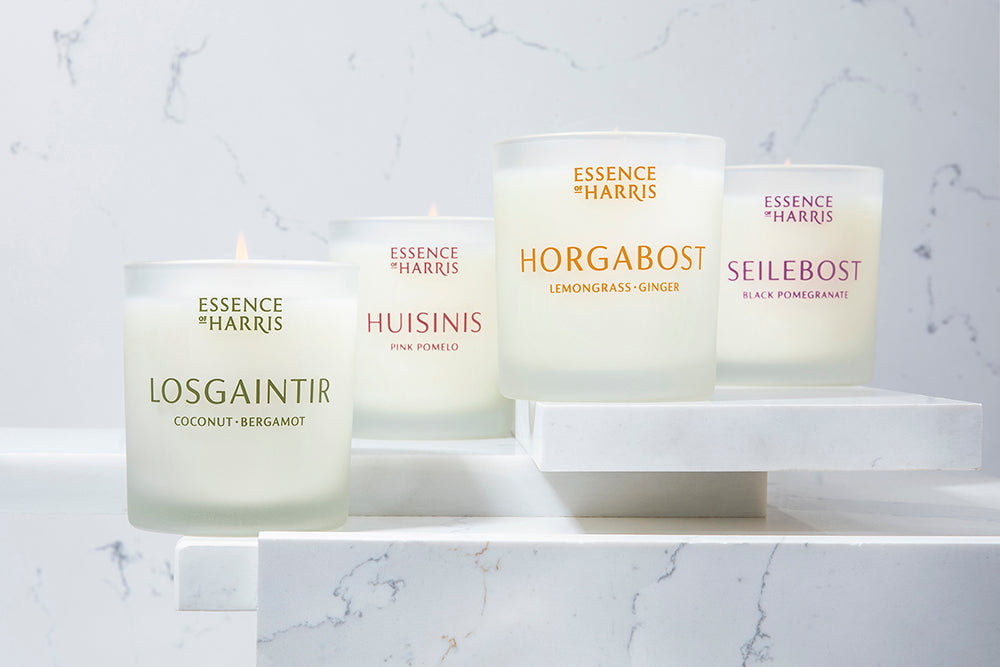 Losgaintir, Huisinis, Horgabost, and Seilebost candles lined up on a marble counter.