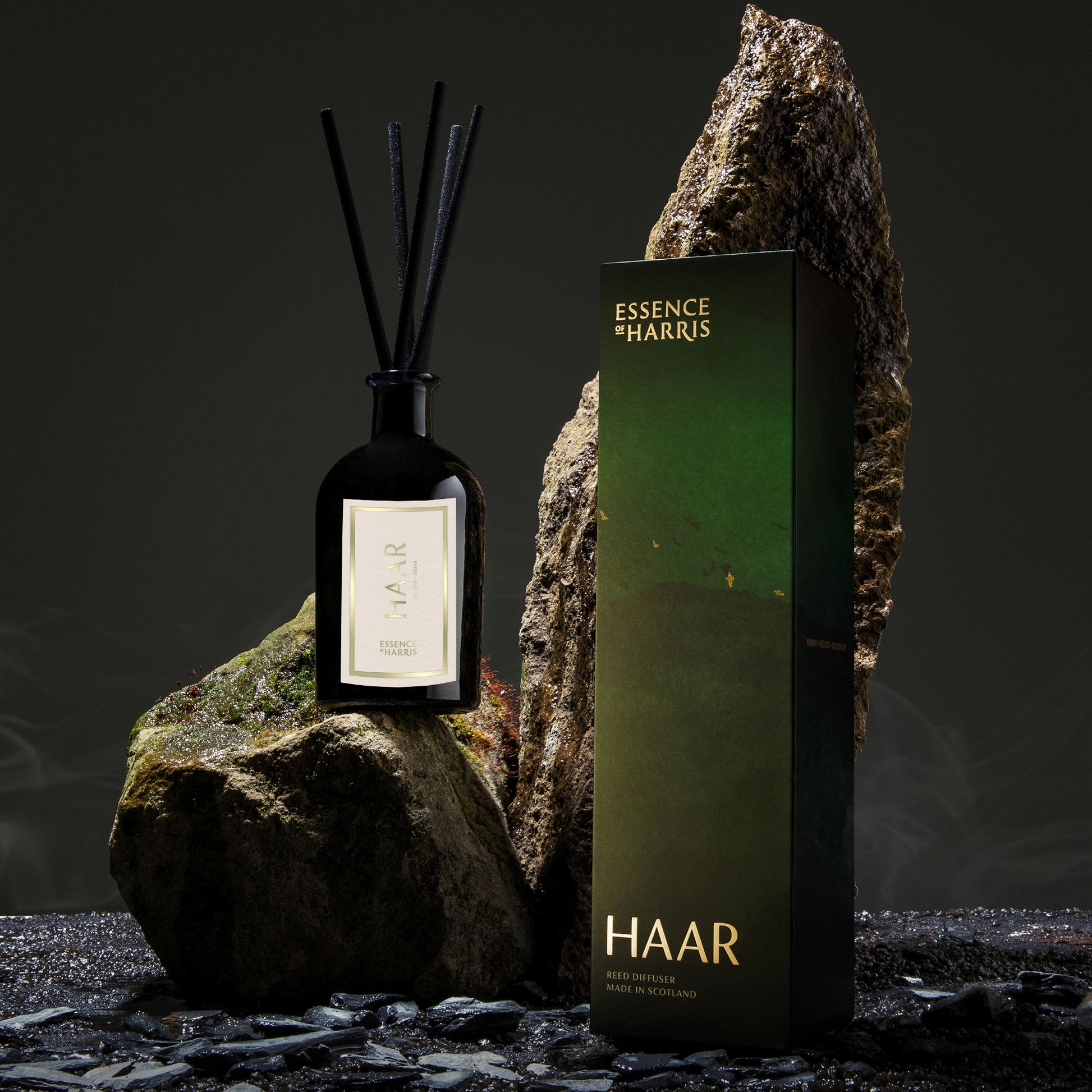 Essence of Harris Haar fig leaf and cedar reed diffuser in dark glass with island inspired reed diffuser box