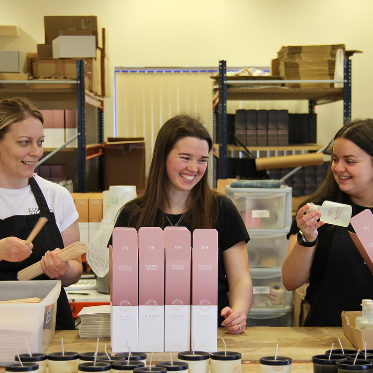 3 members of the Essence of Harris team in the factory boxing Huisinis reed diffusers