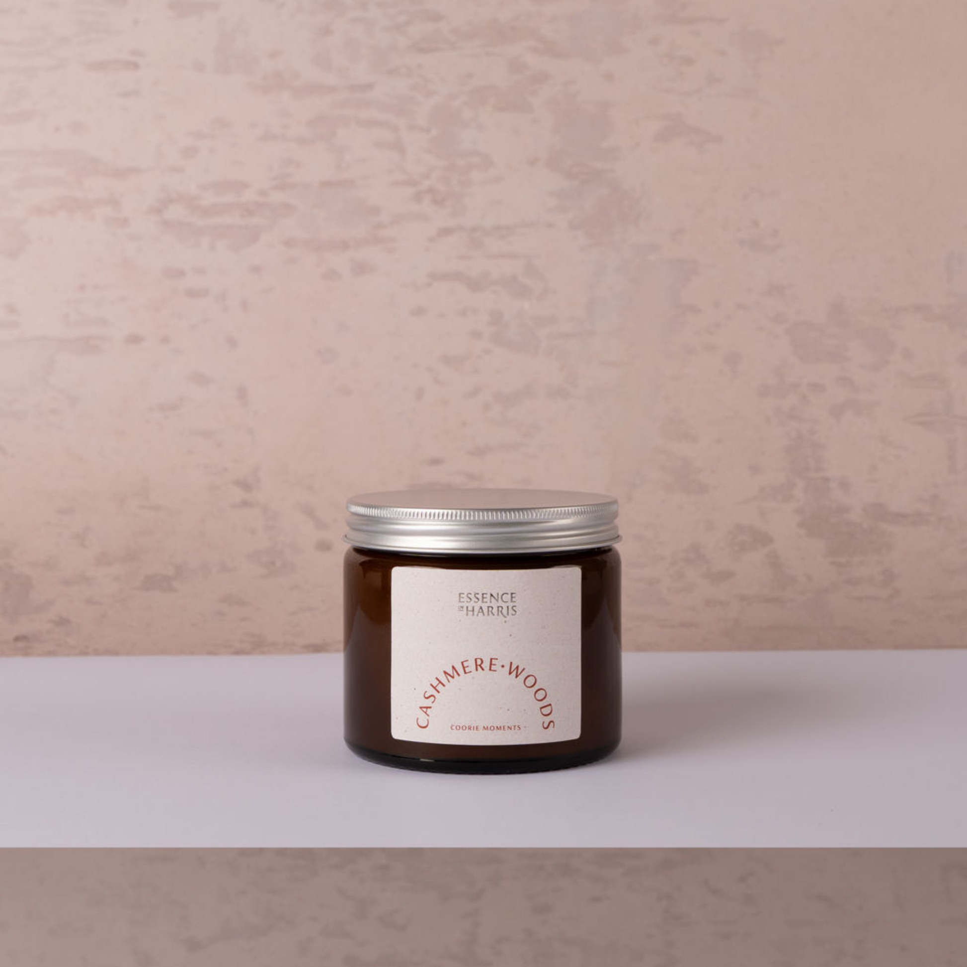 Cashmere woods jar candle with silver lid on neutral backdrop
