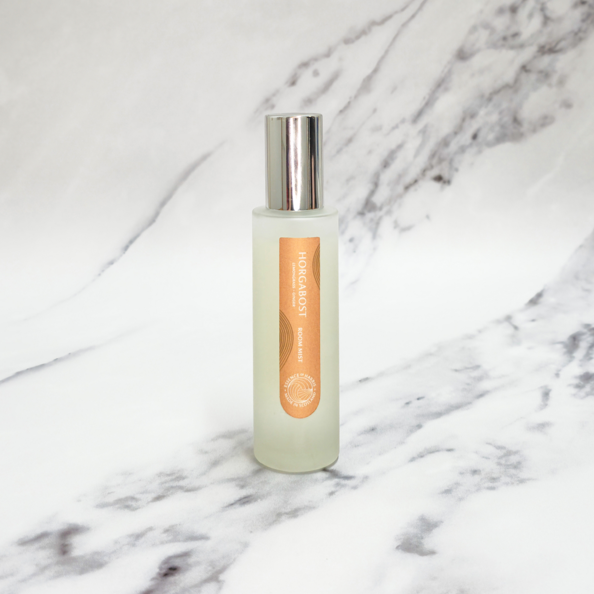 Essence of Harris Horgabost lemongrass and ginger room spray on marble backdrop