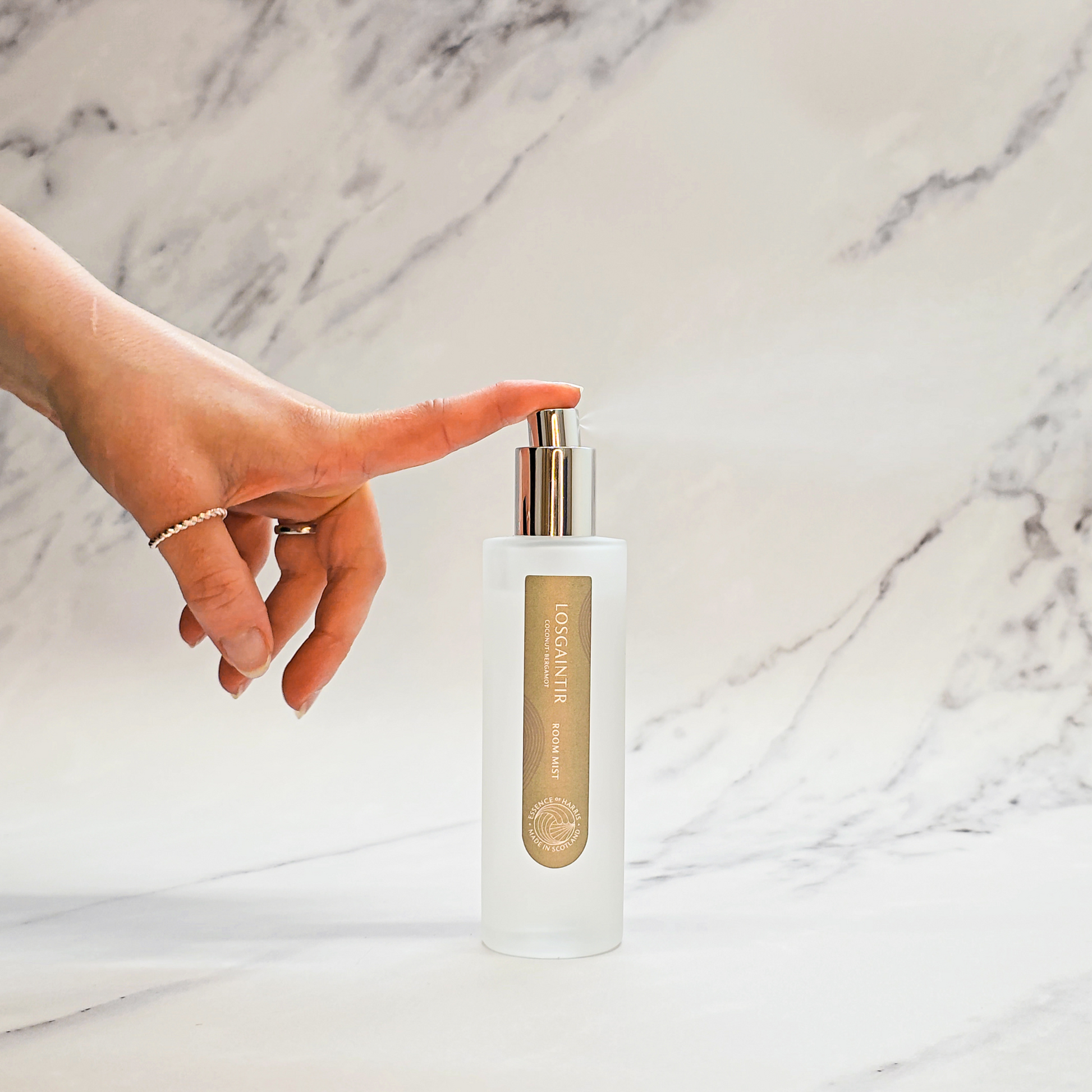 Essence of Harris Losgaintir coconut, bergamot & vanilla room mist in frosted glass bottle with hand spritzing spray