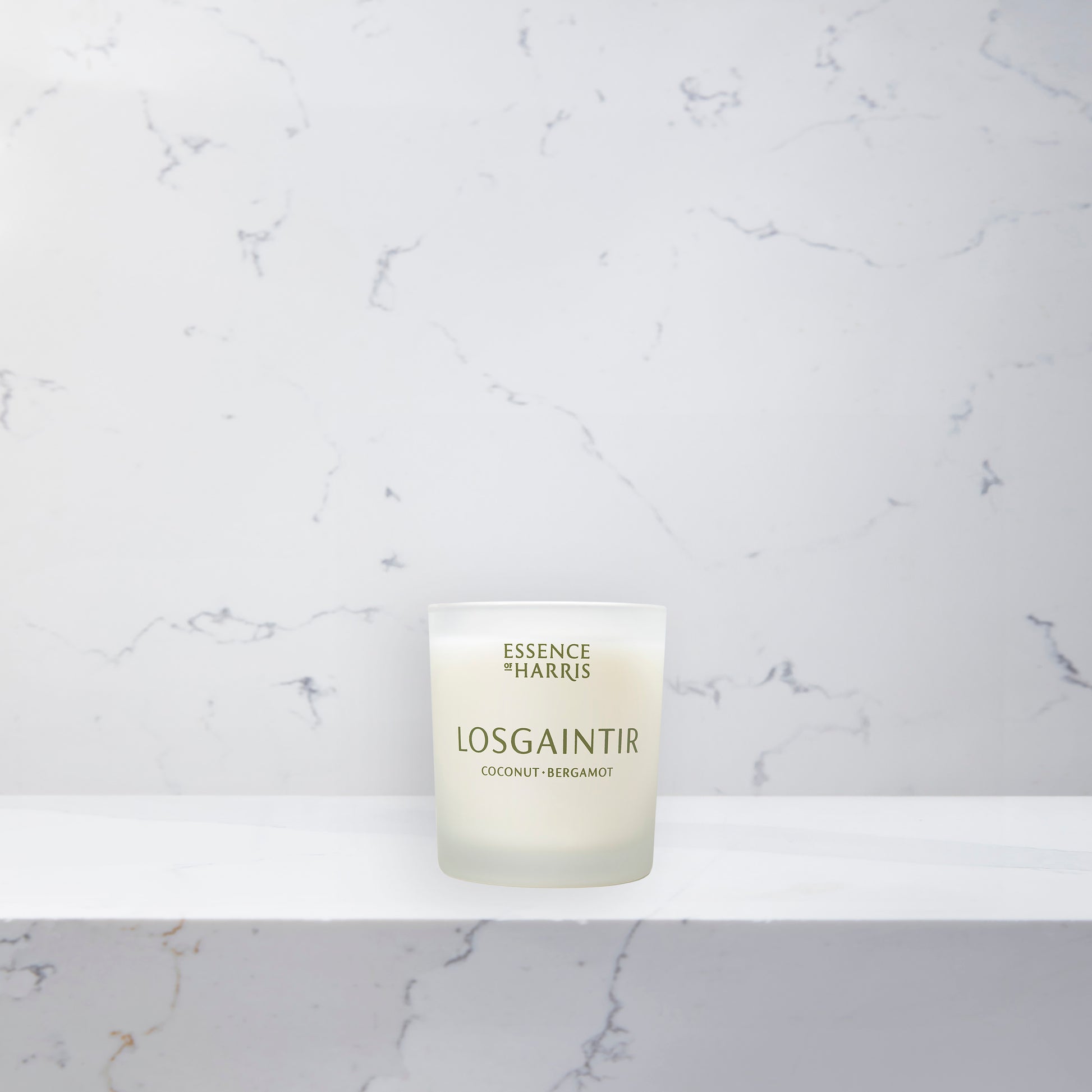Essence of Harris Losgaintir, coconut, bergamot & vanilla soy wax votive candle in frosted glass vessel