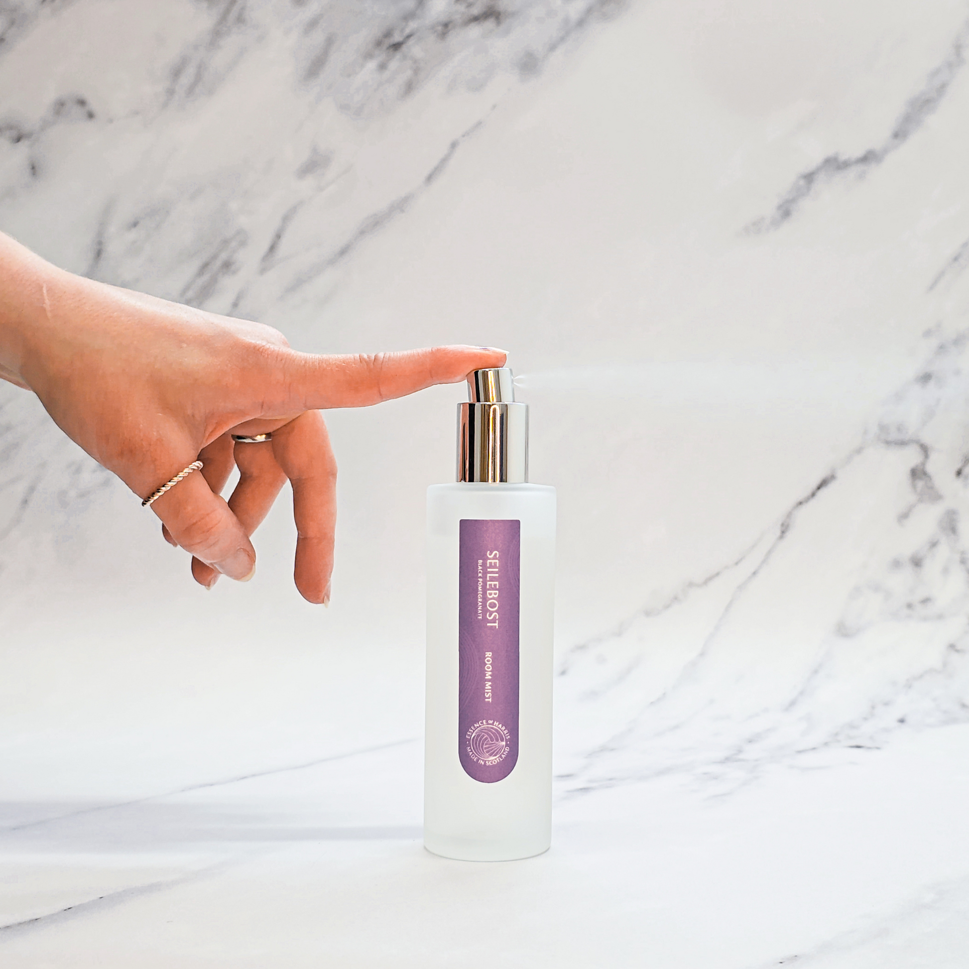 Essence of Harris black pomegranate and plum room mist in frosted glass bottle with hand spritzing spray