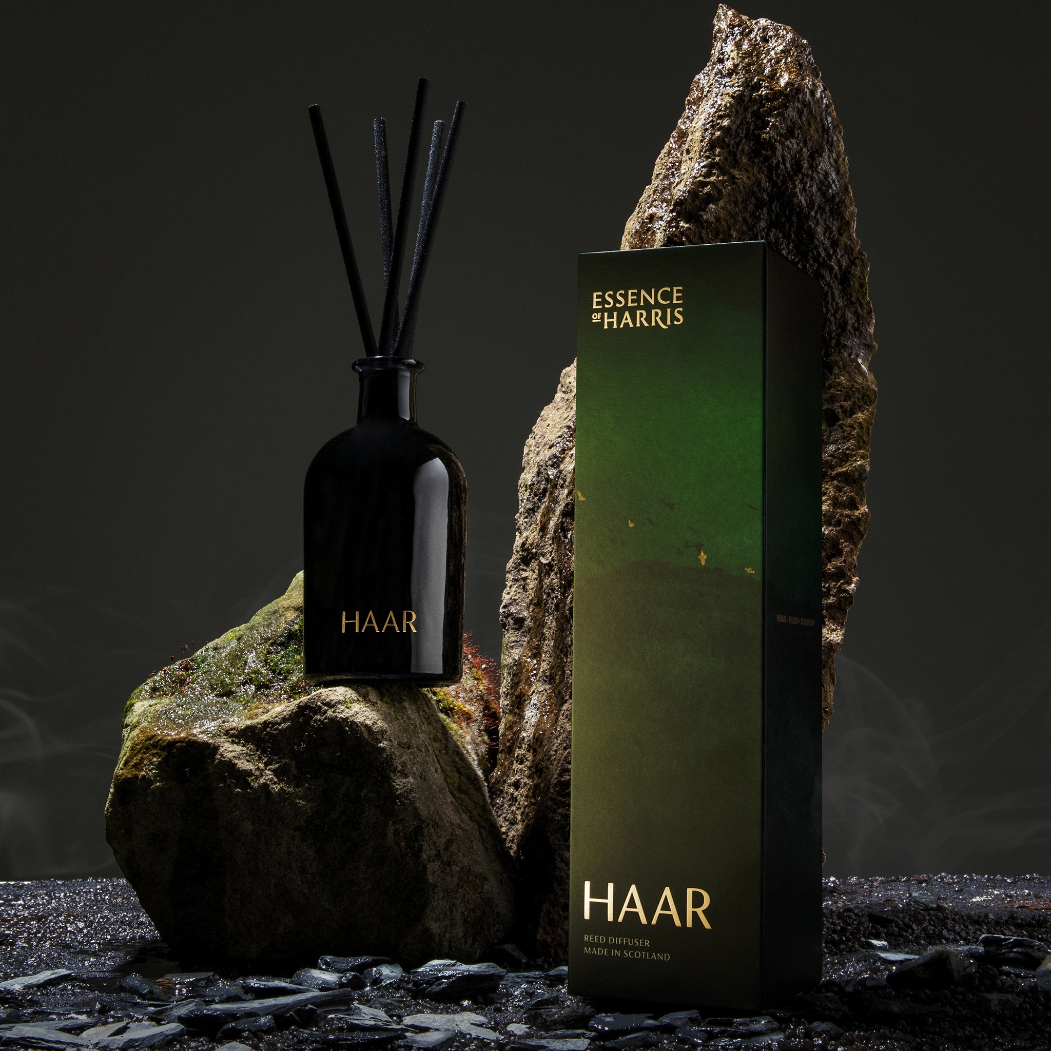 Mara, samphire and sea minerals reed diffuser in smoked glass vessel next to green box