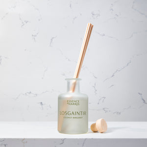 Losgaintir, coconut and bergamot frosted glass reed diffuser on marble background